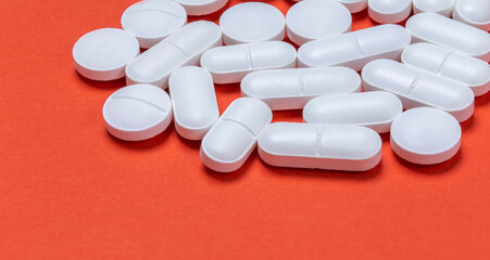 Wall Mural - Medical pills . On red background. Top view . Medicine concept