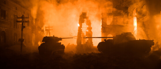 War Concept. Military silhouettes fighting scene on war fog sky background, World War Soldiers Silhouette Below Cloudy Skyline At night. Battle in ruined city.