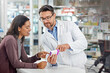 © Reese/peopleimages.com - Healthcare service and pharmacy worker with customer at store counter for medication explanation. Pharmaceutical advice and opinion of pharmacist helping girl with medicine information.