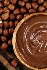 Poster - Hazelnut butter in a plate on a cutting board. 