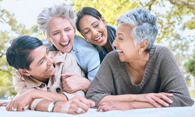 Canvas Print - Wellness, happy and retirement women friends laugh in park for group bonding and relaxing lifestyle. Funny joke and smile of senior people in interracial friendship in nature together.