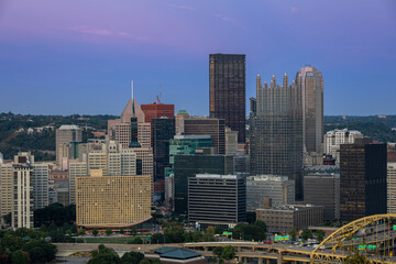 Wall Mural - Cityscape of Pittsburgh and Evening Light. Fort Pitt Bridge. Blurry Ferry Cruise in Background Because of Long Exposure. Selective focus.