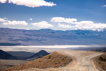 Landscape of Death Valley in California. Road and Cloudy Sky in Background.