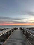 Fototapeta Na sufit - Walkway with sunset sky background over the Gulf of Mexico Emerald Coast Florida 