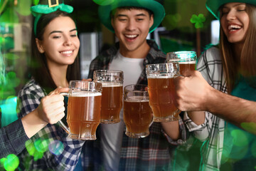 Wall Mural - Happy young friends with beer celebrating St. Patrick's Day in pub