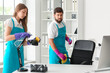 © Pixel-Shot - Young janitors cleaning in modern office