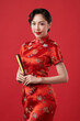 Asian chinese woman in traditional dress on red background. Chinese new year festival