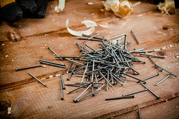 Construction nails on the table.