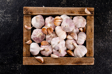 Poster - Fresh garlic on a wooden tray. 