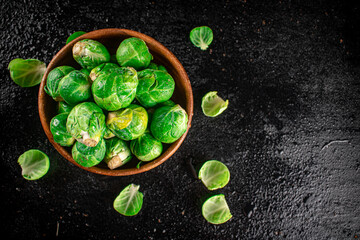 Wall Mural - Brussels sprouts in a wooden bowl. 