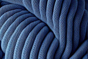Sea blue knitted fabric surface abstract background. Decorative knitwear texture closeup, detailed woolen textile. Natural material Sea blue knitted fabric pattern.
