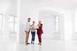 © New Africa - Real estate agent showing new apartment to couple