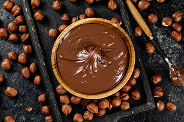 Wall Mural - Hazelnut butter on a cutting board with a spoon. 