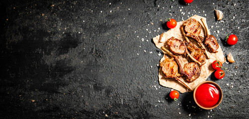 Poster - Grilled lamb rack on paper with tomato sauce and cherry tomatoes. 