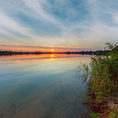 Wall Mural - picturesque summer evening sunset lake calm shore. concept of tranquil country life, eco friendly to