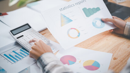 Business people read business statistics chart reports, to analyze and improve corporate strategy, manage financial and marketing documents, update annual budget accounts, company growth data..