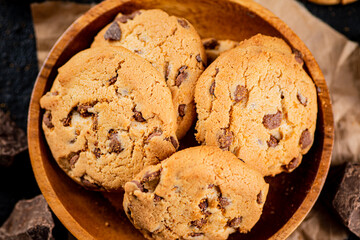 Wall Mural - Homemade cookies with chocolate. Against a dark background