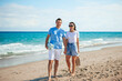 © travnikovstudio - Young couple on white beach during summer vacation.