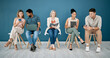 © Lou W/peopleimages.com - Human resources, hr and people in a waiting room for job interview at office. Onboarding, hiring or group of business men and women with book and technology, wait and sitting in a row for recruitment