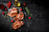 Fototapeta Kuchnia - Grilled pork steak with cherry tomatoes and rosemary. 