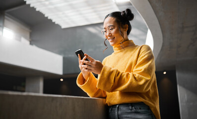 Poster - Phone, texting and woman in office building, happy and smile while on internet, search and reading. Asian, girl and business entrepreneur on smartphone for research, social media or browsing in Japan