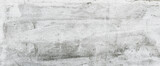 Fototapeta Abstrakcje -  Tło, tekstura grunge naturalnej postarzanej ściany po nałożeniu siatki elewacyjnej. Klej i siatka do systemu dociepleń.
