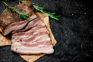 Wall Mural - Sliced pork lard with rosemary. 