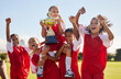 © Nina/peopleimages.com - Football, team and trophy with children in celebration together as a girl winner group for a sports competition. Soccer, teamwork and award with sport player kids celebrating success outdoor