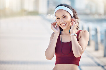 Wall Mural - Fitness, portrait and woman with music at promenade, marathon training and wellness in Miami. Sports, happy athlete and outdoor runner with earphones for running exercise, cardio workout and sunshine