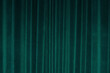 Vertical fold on green velvet curtains for background and design. Soft focus