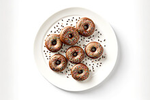 Small Chocolate Donuts With Beaful Sprinkling On White Plate