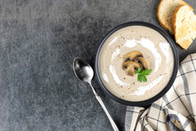 Mushroom Soup Puree With Croutons On A Gray Background. Champignon Cream Soup. Top View. Copy Space.