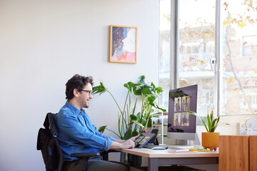 Positive man on video conference in office