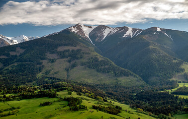 Wall Mural - Beautiful view of Western Tatras Mountains with peak Baranec in Slovakia. Green landscape and hills. Aerial drone photography