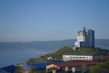 Canvas Print - Urban landscape with a view of the coastline and the sea.