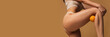 © master1305 - Cropped image of slim smooth female legs, buttocks over light brown background. Anti-cellulite care. Concept of body and skin care, fitness, health, wellness. Banner, flyer. Copy space for ad