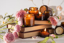 A Set Of Different Aroma Candles In Brown Glass Jars. Scented Handmade Candle. Soy Candles Are Burning In A Jar. Aromatherapy And Relax In Spa And Home. Fire In Brown Jar.