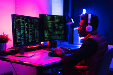 Software developer coding on his computer. Coding and hacking concept