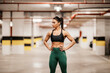 © dusanpetkovic1 - Portrait of a muscular urban sportswoman posing in underground garage.