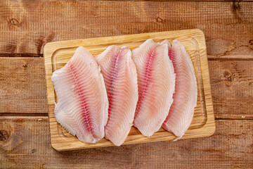 Poster - Fresh fish fillet on a cutting board. 