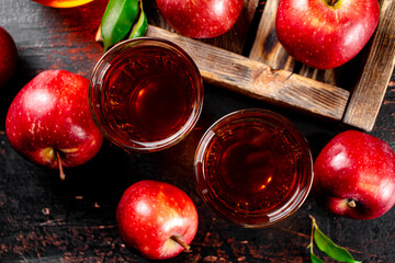 Sticker - A glass of apple juice on the table. 