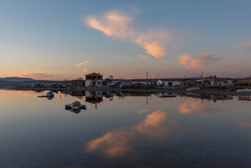 Wall Mural - View of boats on sunset with reflection on the sea, colorful sky and clouds on sunset time with silhoutte of vehicles