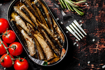 Sticker - Sprats with cherry tomatoes on the table. 