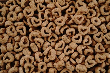 Poster - Heart shaped cereal valentines day background, selective focus