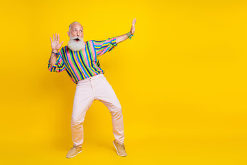 Poster - Full length photo of good mood impressed guy dressed striped shirt having fun looking empty space isolated yellow color background