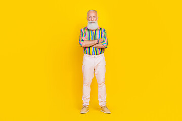 Sticker - Full size portrait of concentrated cool granddad folded hands posing isolated on yellow color background