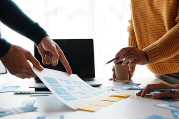 designers, programmers, and mobile application developers work together to innovate modern and relev