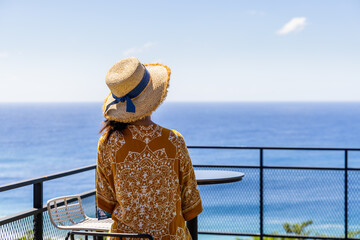 Sticker - Woman enjoy the sea view on lookout