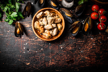 Canvas Print - Pickled mussels in a wooden plate on the table. 