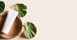 Facial moisturizer on wooden plate with Centella leaves  on beige background flat lay, top view. Set for skin and body care beauty product banner format AI Generated